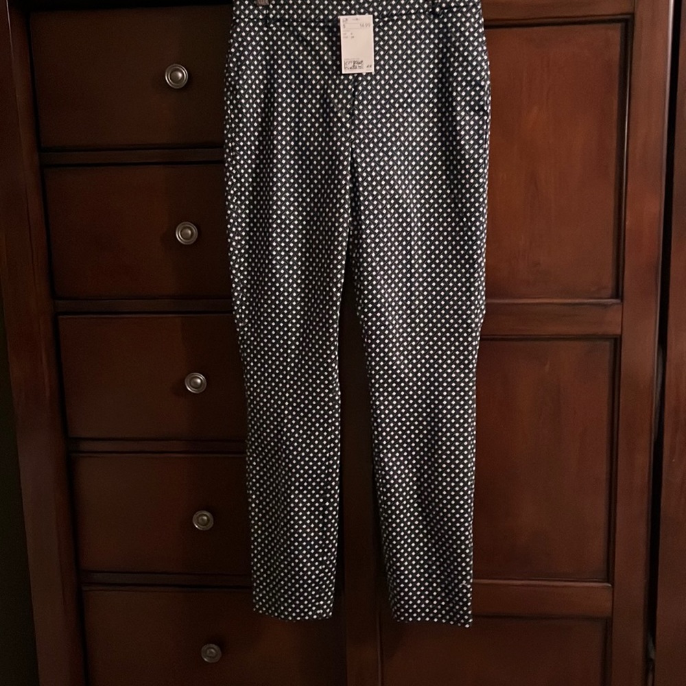 Black patterned elastic waist pants with belt loops. NWT